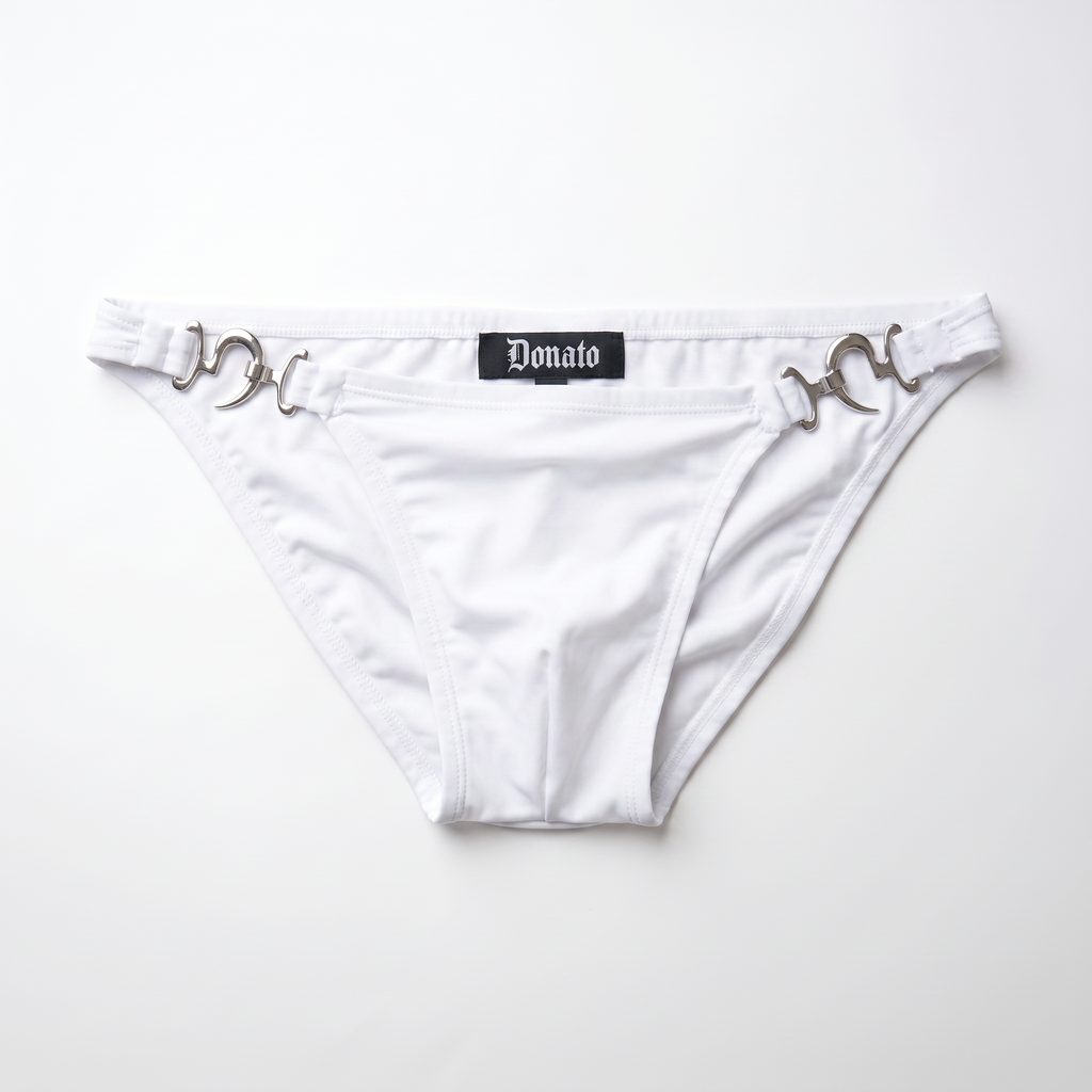 White bikini bottom featuring silver horsebit hardware on the sides and a black central label with the brand name 'Donato' in gothic font, laid flat on a white background.