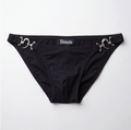 Black bikini bottom featuring silver horsebit hardware on the sides and a central black label with the white gothic-style 'Donato' brand name, laid flat on a light gray background.