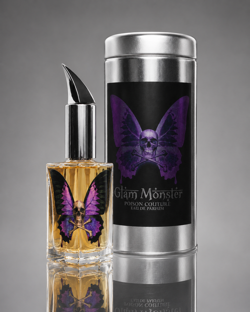 Glam Monster perfume bottle and packaging with butterfly design on a gray background
